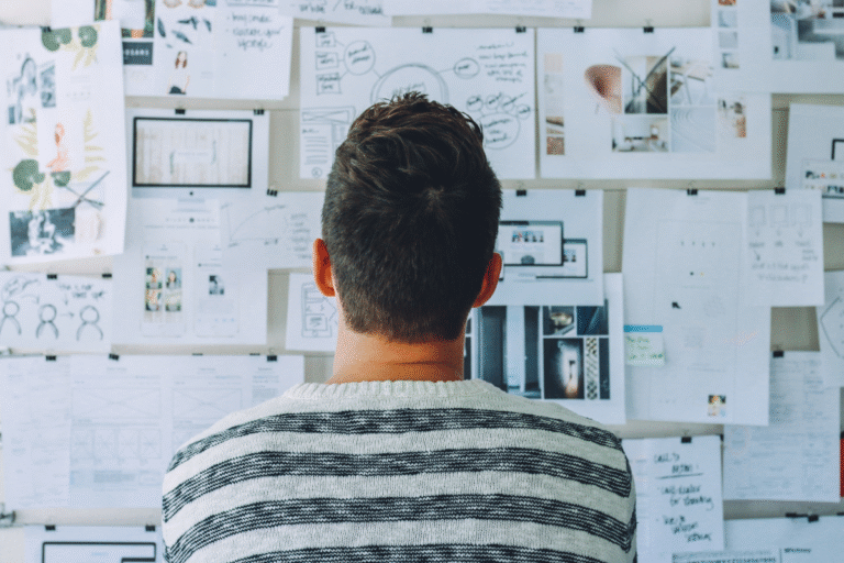 Man staring at a board of charts wondering "What is a High Control Religion"